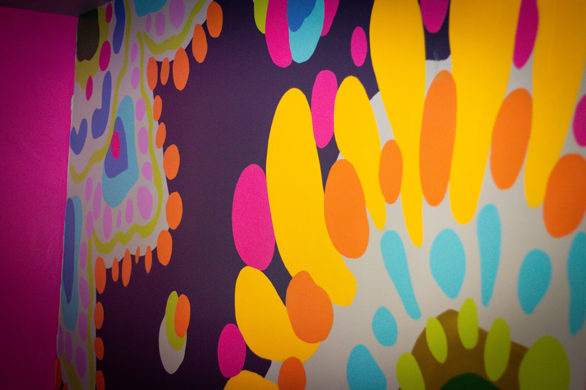 Hand-painted floral mural on the wall of the Gucci Room